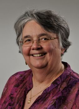 Susan Scott smiling, neutral background